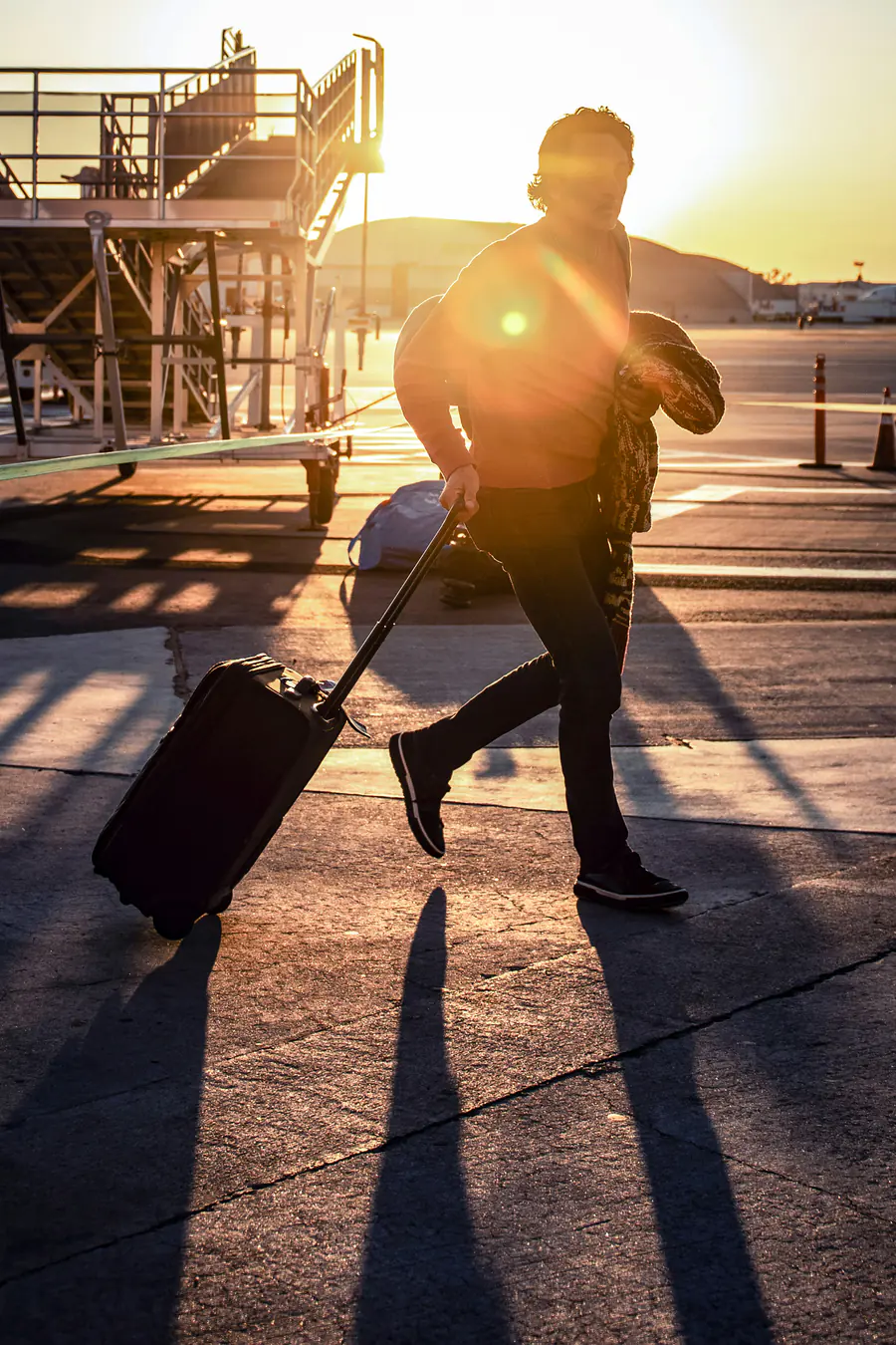 Traveller walking with luggage at an airport